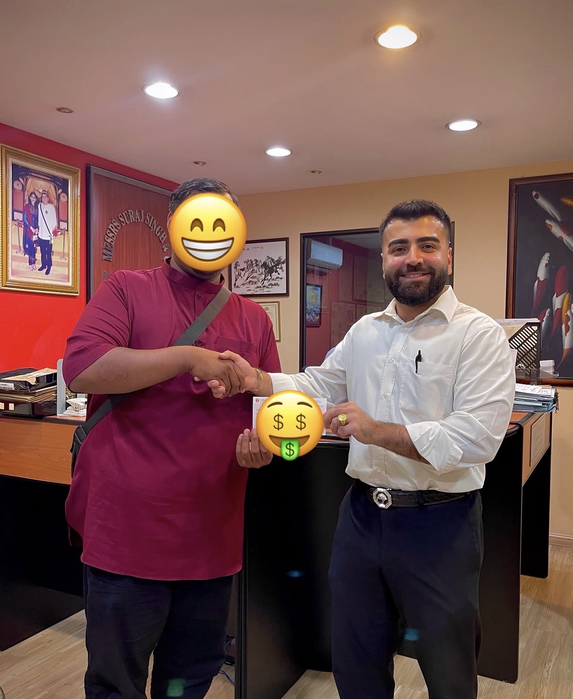 Client receiving settlement cheque at Peguam Rohan's office